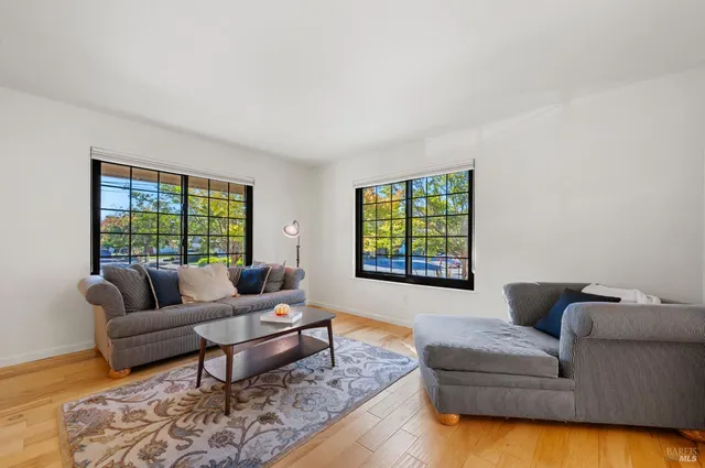 a view of dining room with furniture and wooden floor