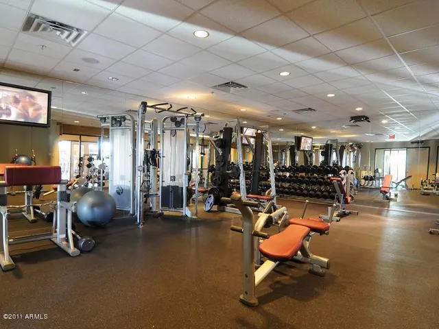 a wooden bench sitting in front of a building
