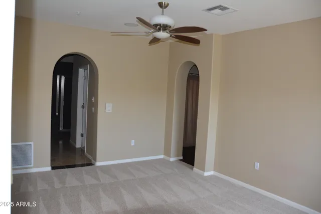 a view of a livingroom with a ceiling fan