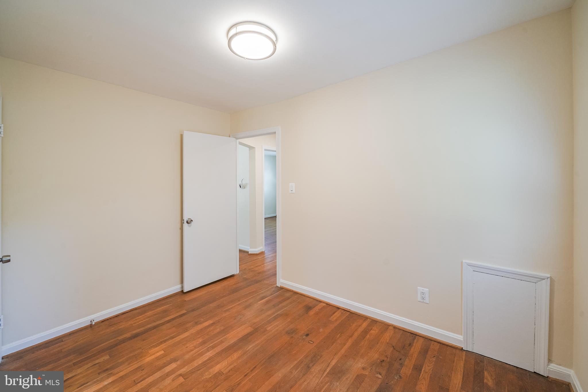 11500 Mapleview Drive Silver Spring, MD 20902 - Photo 14 of 32 a view of an empty room with wooden floor