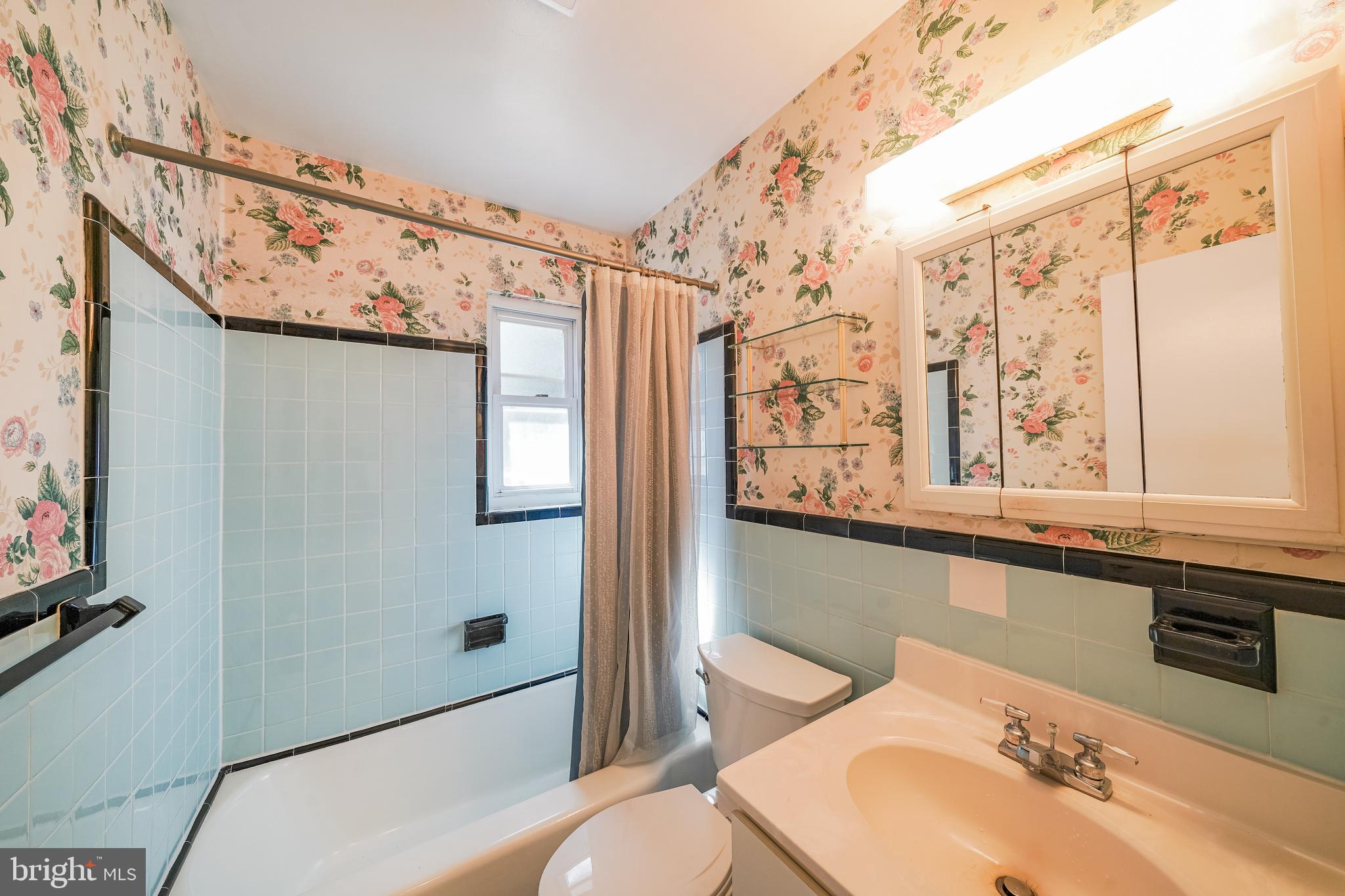 11500 Mapleview Drive Silver Spring, MD 20902 - Photo 22 of 32 a bathroom with a sink a toilet and shower