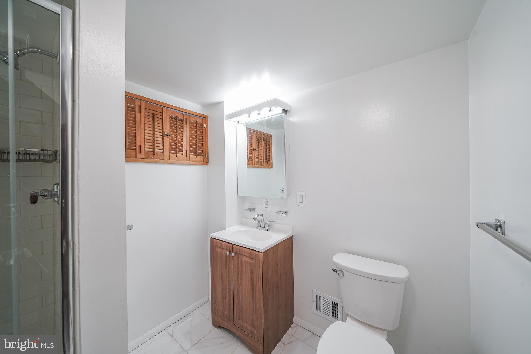 11500 Mapleview Drive Silver Spring, MD 20902 - Photo 27 of 32 a bathroom with a toilet sink and mirror