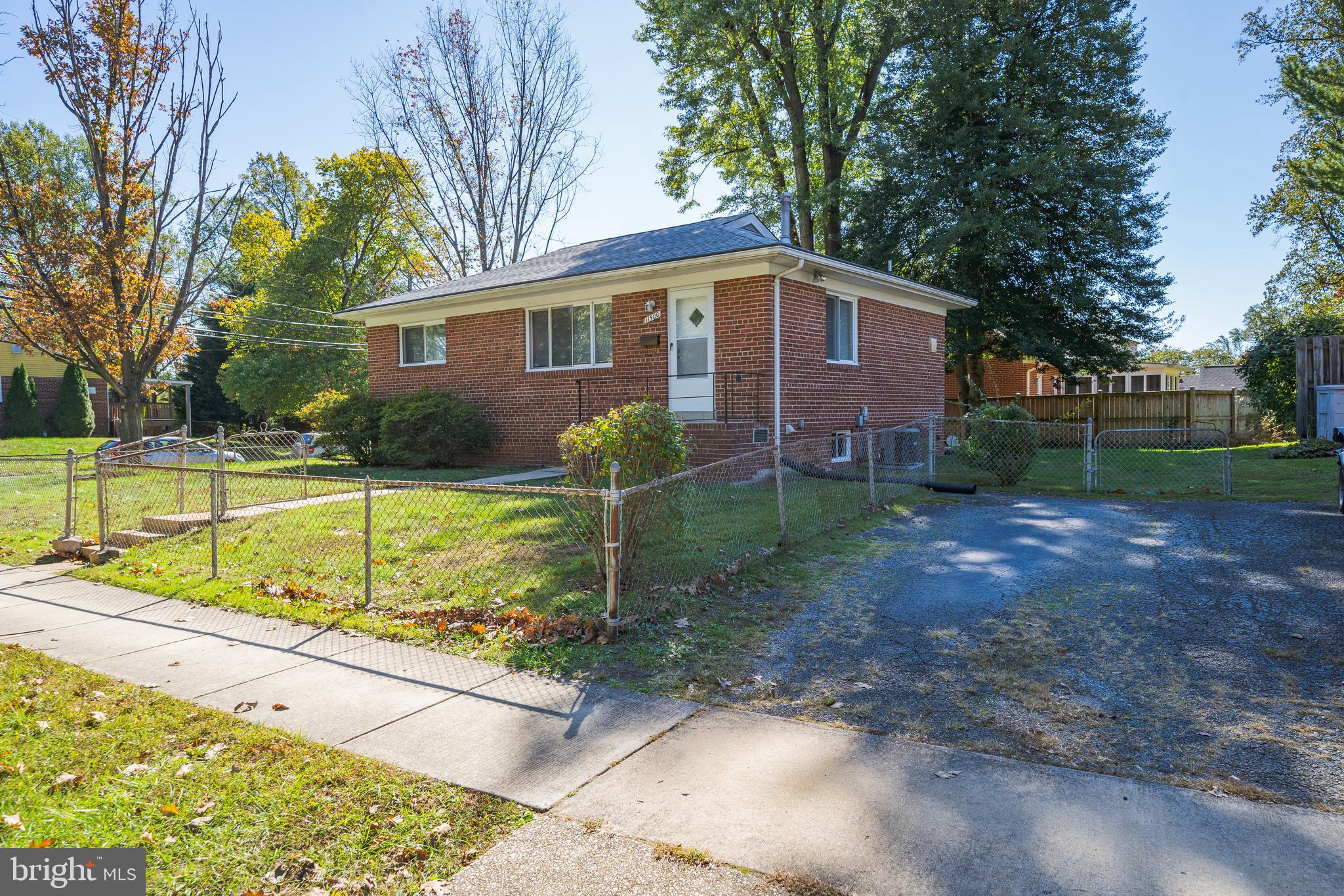 11500 Mapleview Drive Silver Spring, MD 20902 - Photo 3 of 32 a view of a house with backyard and sitting area