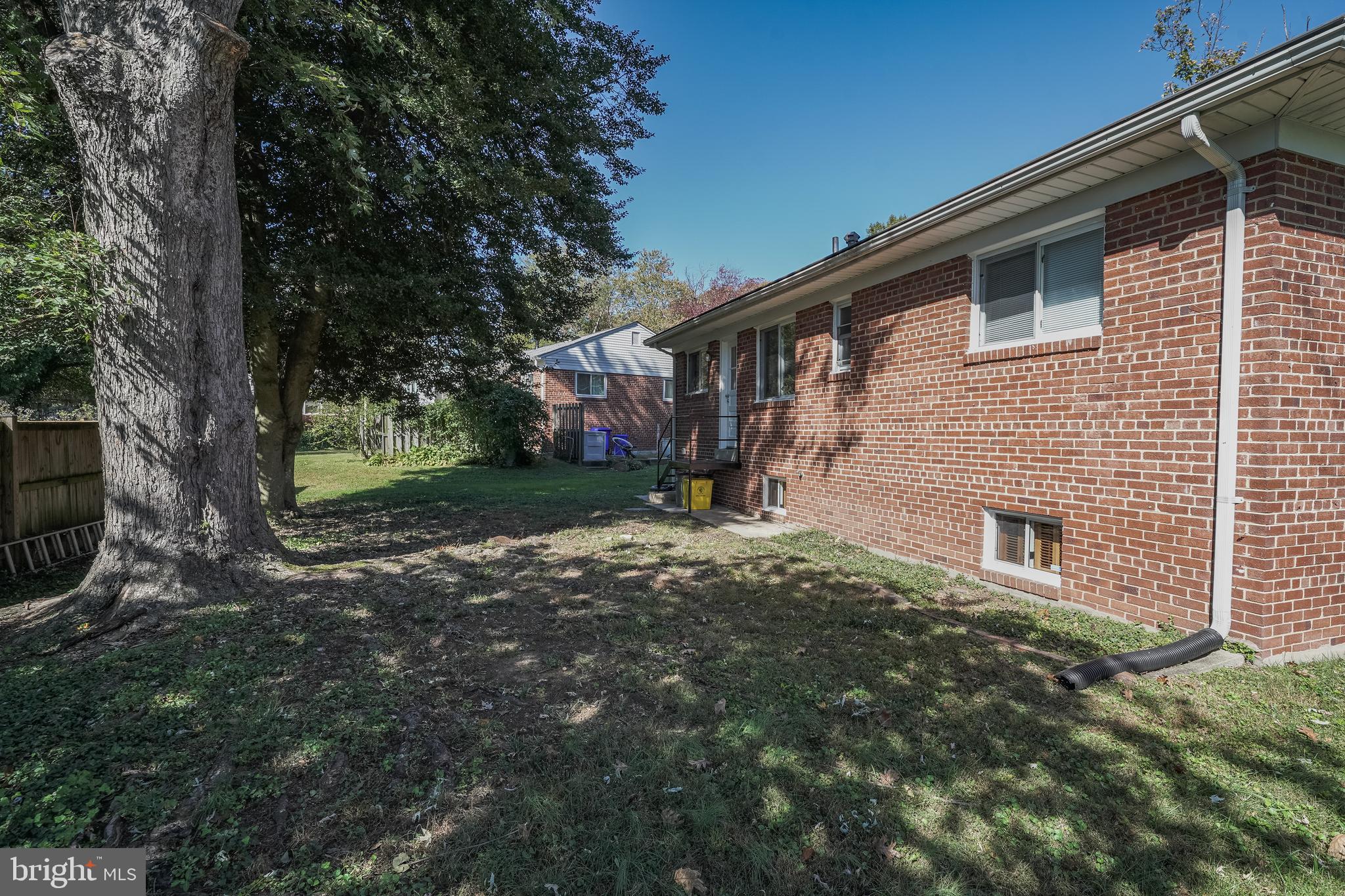 11500 Mapleview Drive Silver Spring, MD 20902 - Photo 4 of 32 a backyard of a house with lots of green space