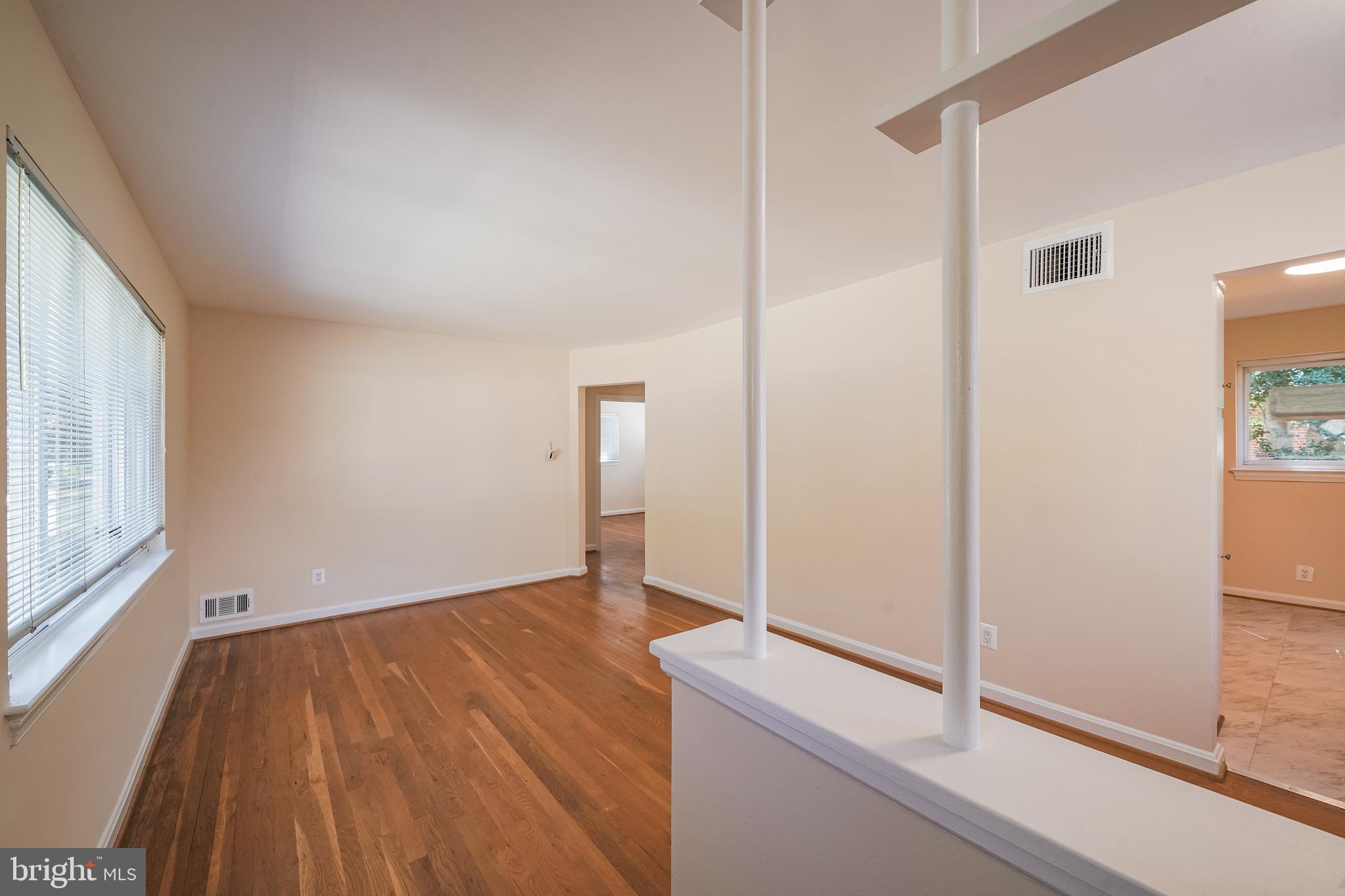 11500 Mapleview Drive Silver Spring, MD 20902 - Photo 7 of 32 a view of empty room with wooden floor and fan