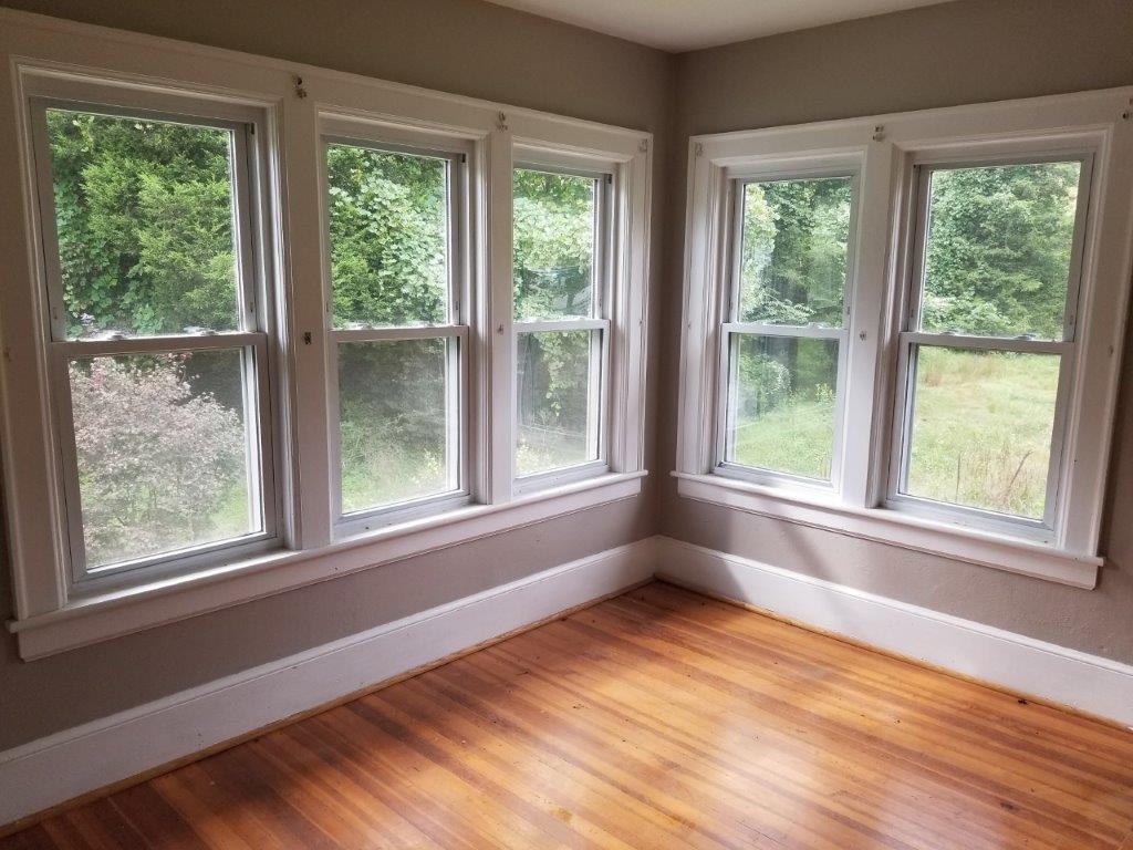5913 Brethren Road Roanoke, VA 24014 - Photo 11 of 17 a view of an empty room with wooden floor and a window