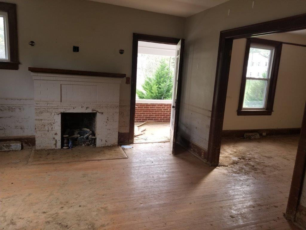 5913 Brethren Road Roanoke, VA 24014 - Photo 5 of 17 a view of empty room with fireplace and window