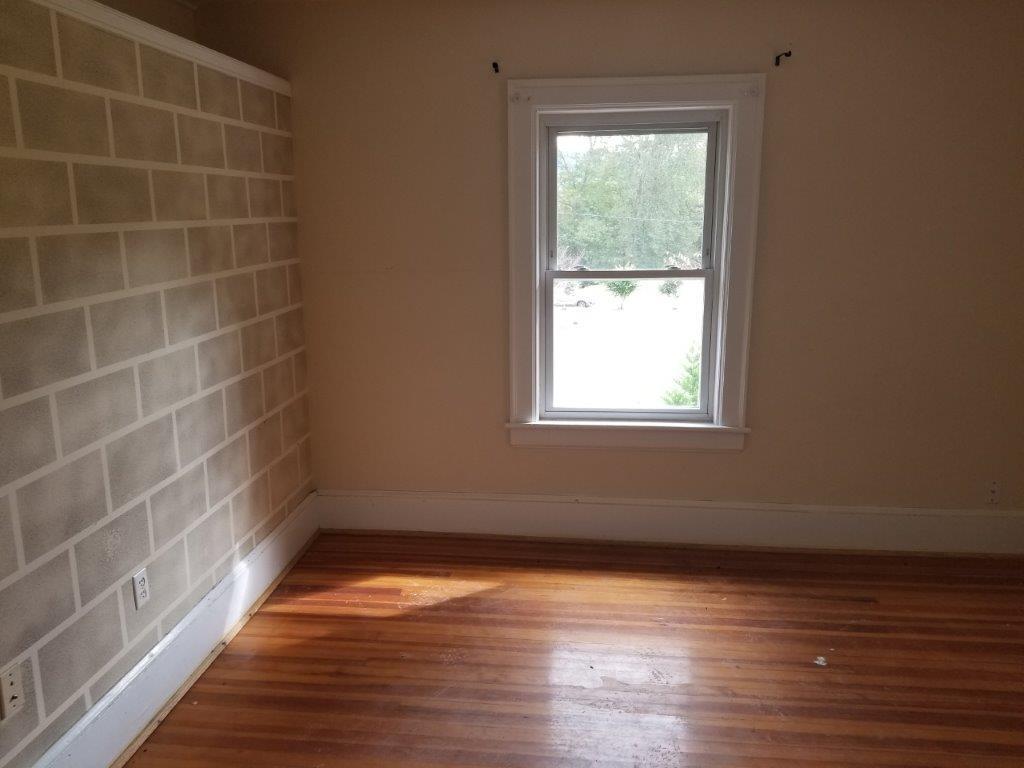 5913 Brethren Road Roanoke, VA 24014 - Photo 9 of 17 a view of a small space with wooden floor and a window