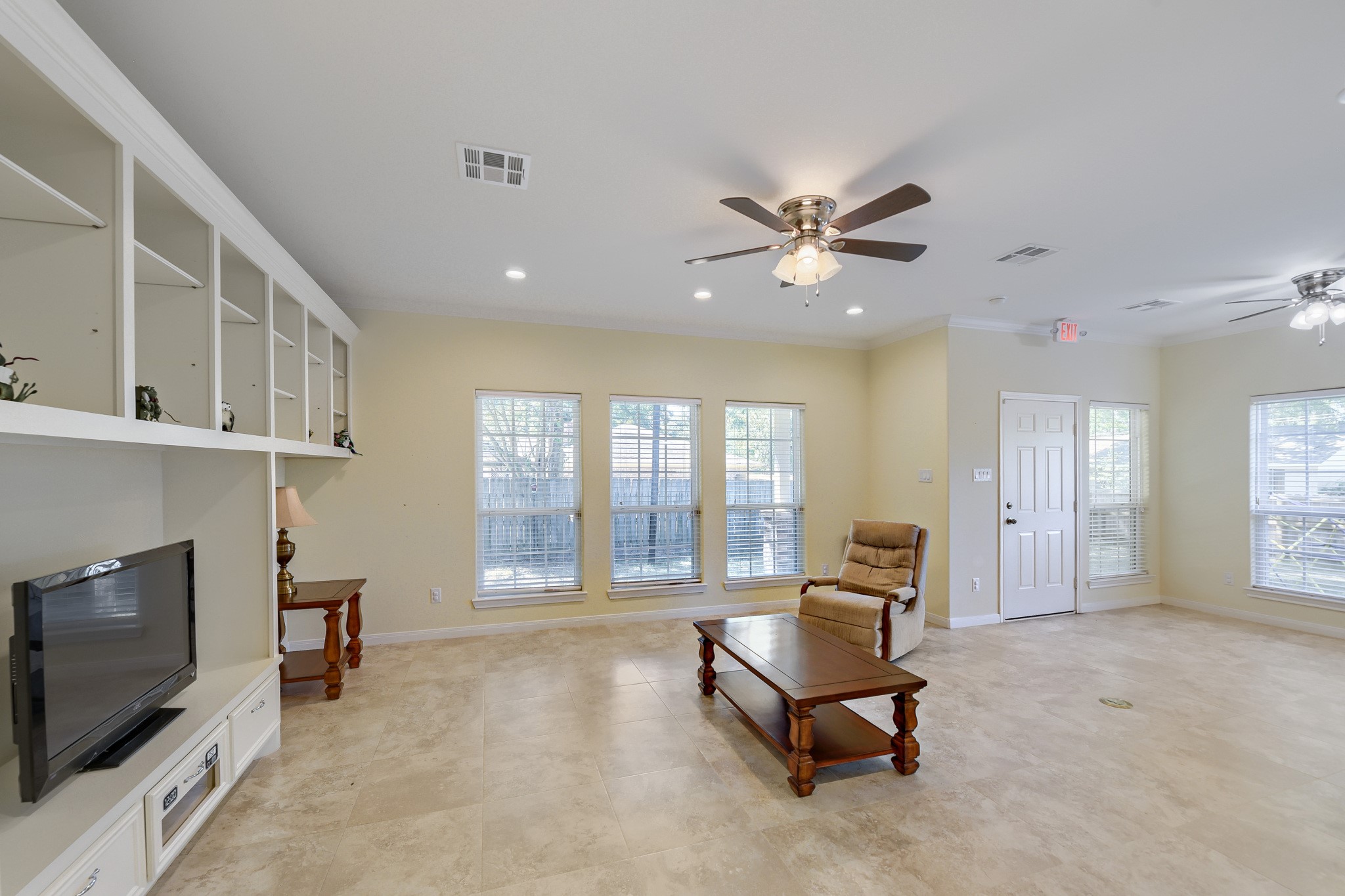 2215 Penick Road Waller, TX 77484 - Photo 7 of 33 Living room with abundance of natural light and a built in shelving unit