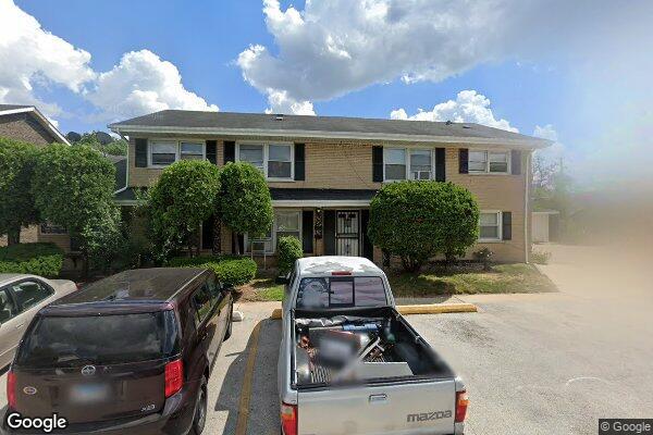a car parked in front of a house