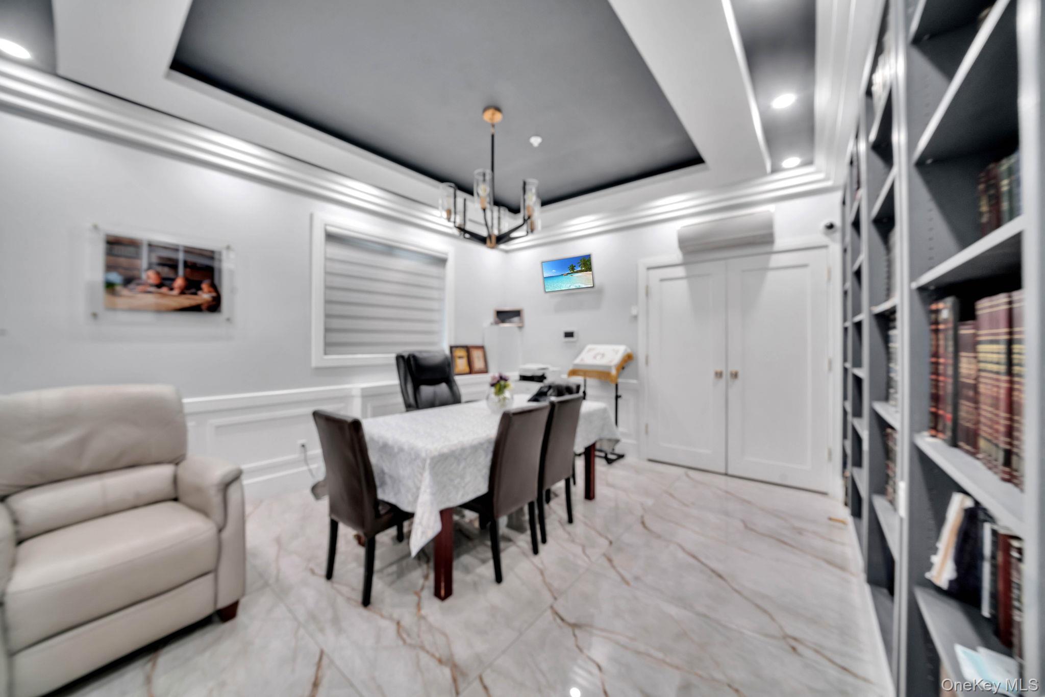 48 Garden Terrace Spring Valley, NY 10977 - Photo 13 of 20 a view of a livingroom with furniture and a bookshelf