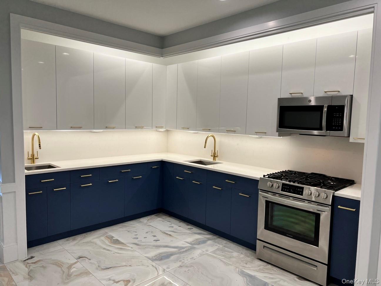 48 Garden Terrace Spring Valley, NY 10977 - Photo 17 of 20 a kitchen with stainless steel appliances granite countertop a sink and a stove top oven