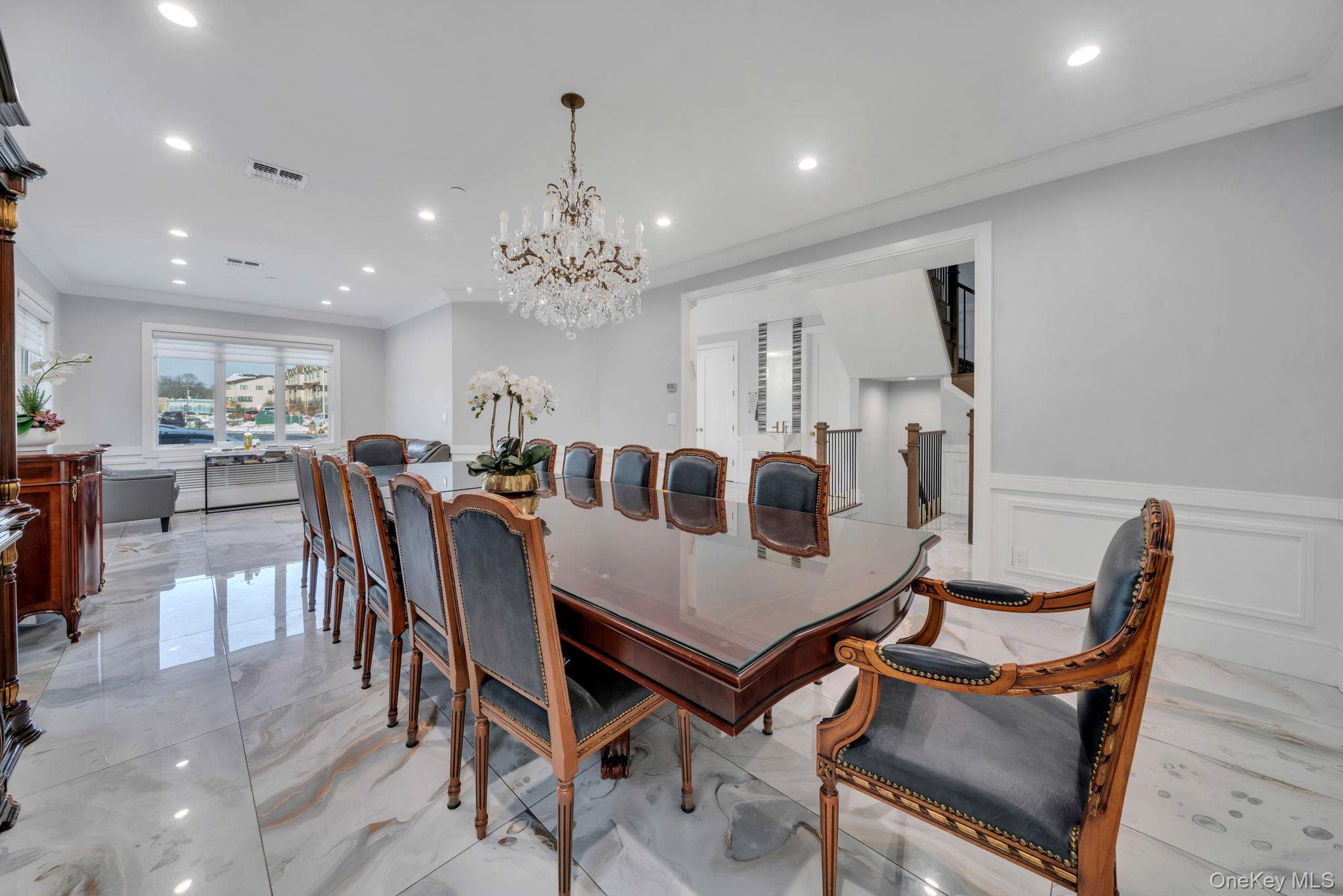 48 Garden Terrace Spring Valley, NY 10977 - Photo 4 of 20 a view of a dining room with furniture and chandelier