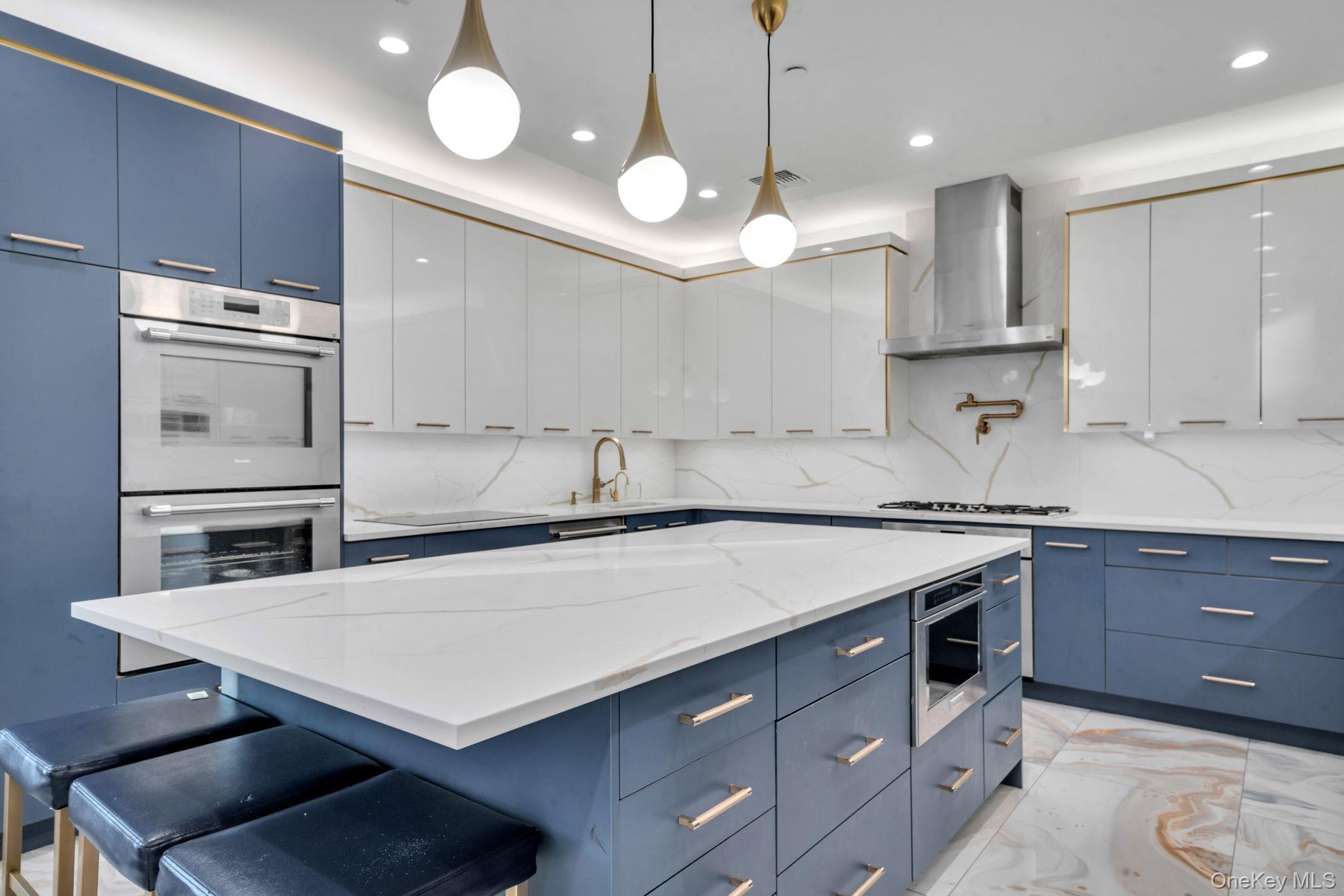 48 Garden Terrace Spring Valley, NY 10977 - Photo 10 of 20 a kitchen with a stove a sink and a refrigerator