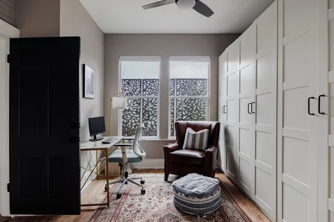 a living room with furniture and a gate