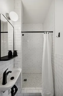 a bathroom with a sink and a shower