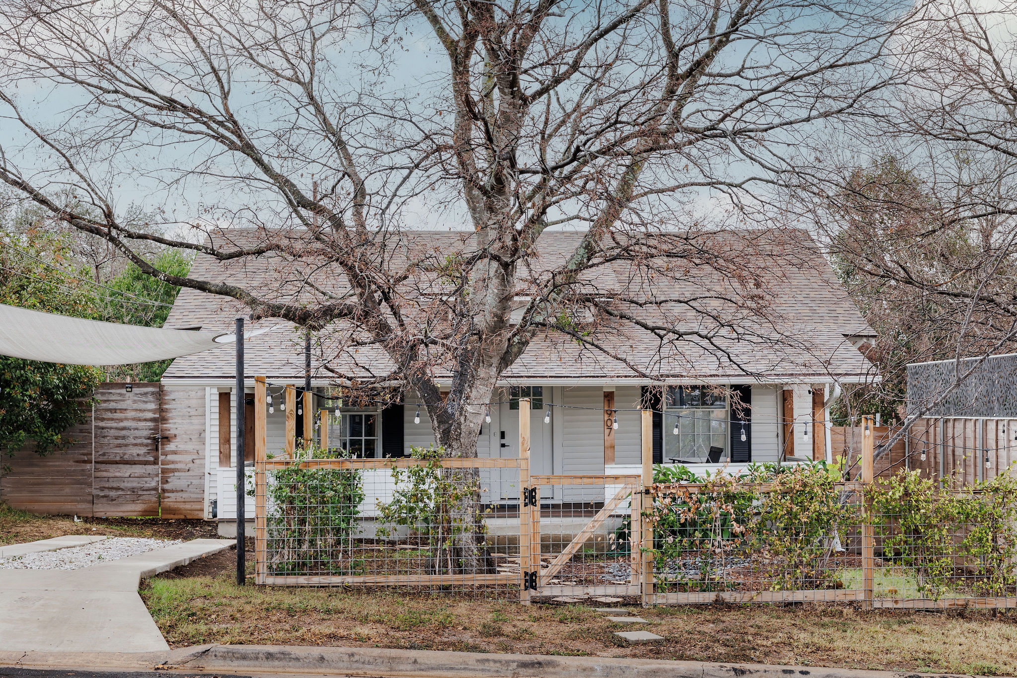 1907 Tillery Street Austin, TX 78723 - Photo 2 of 28 front view of a house with garden