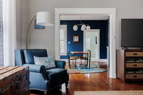 a living room with furniture and a flat screen tv