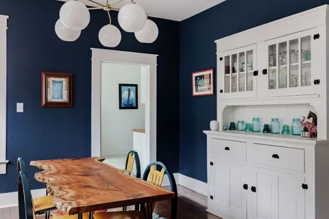 a kitchen with a table and chairs in it