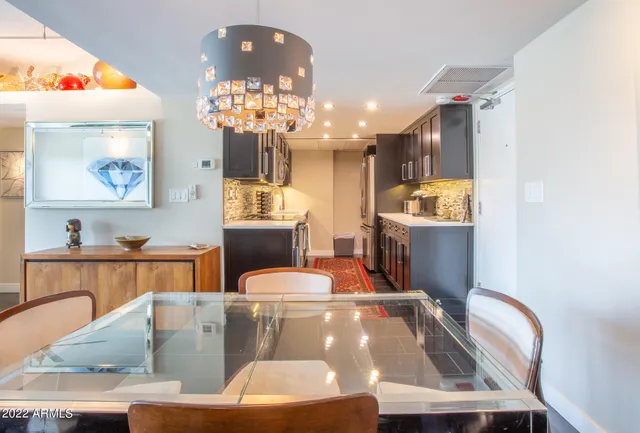 a bedroom with a bed dresser and furniture