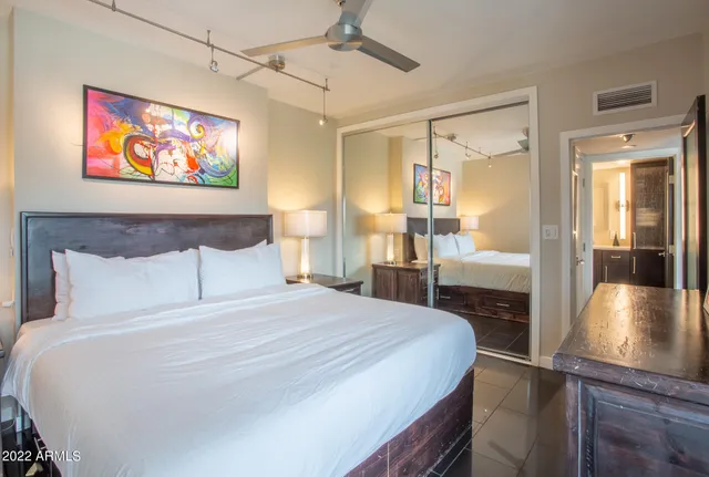 a bathroom with a sink a mirror and a shower