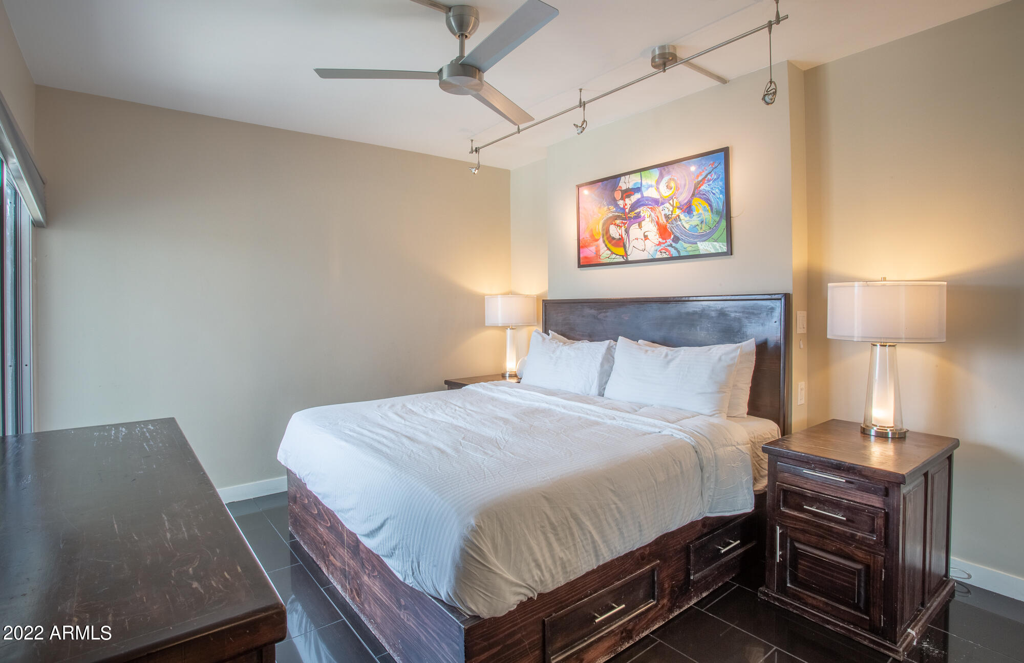 805 North 4th Avenue, Unit 708 Phoenix, AZ 85003 - Photo 17 of 31 a bedroom with a bed and a lamp on the dresser