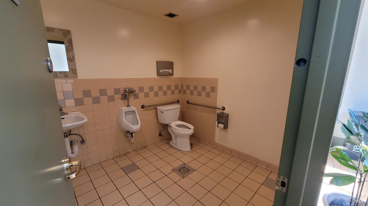 613 4th Street Santa Rosa, CA 95404 - Photo 11 of 12 a bathroom with a toilet and a sink