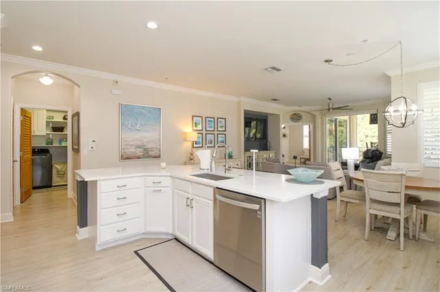 a kitchen with a sink and cabinets