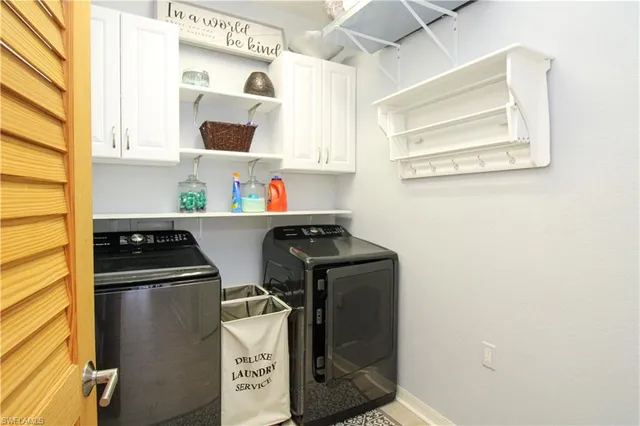 a kitchen with stainless steel appliances granite countertop a refrigerator and a stove