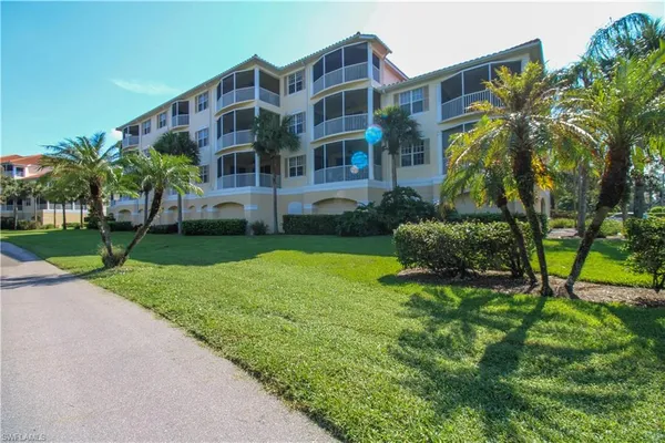 a view of a building with a yard
