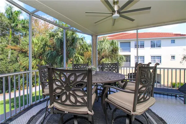 a view of a patio with a dining table and chairs