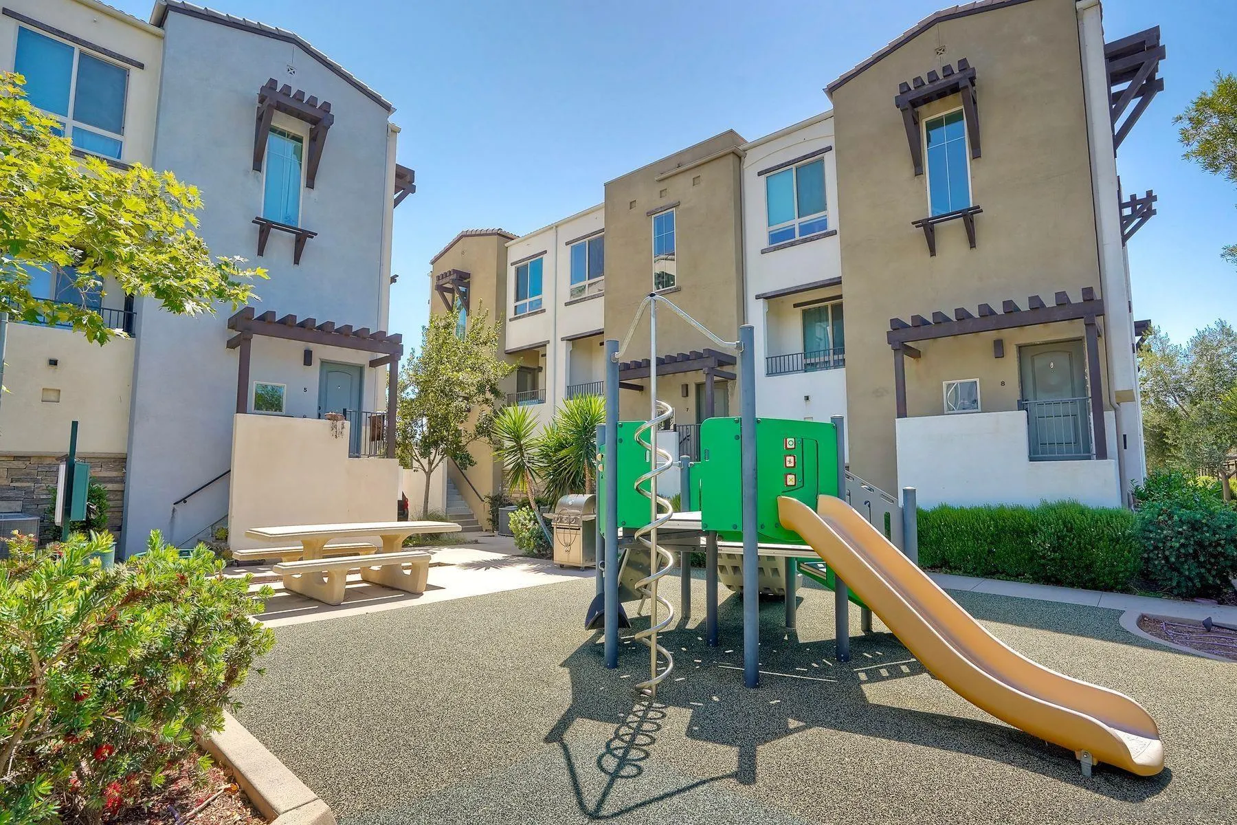 8850 Olive Lane, Unit 7 Santee, CA 92071 - Photo 24 of 27 a view of a building with a garden and plants