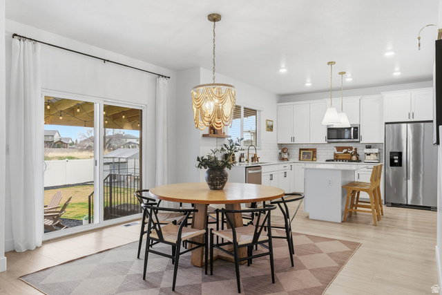 596 South Meade Street Mapleton, UT 84664 - Photo 6 of 38 Dining room with hanging lights and light wood-style flooring