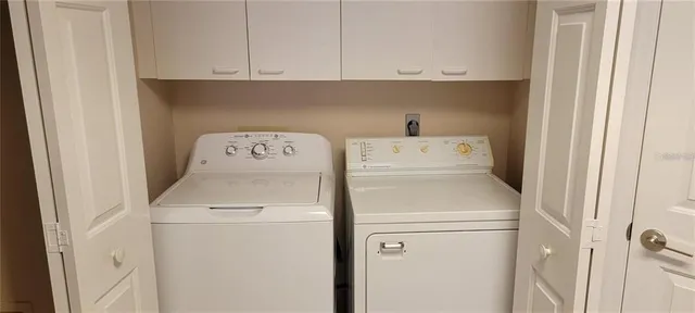 a utility room with dryer and washer