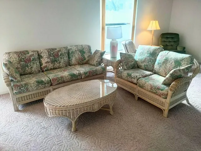 a living room with furniture and a couch