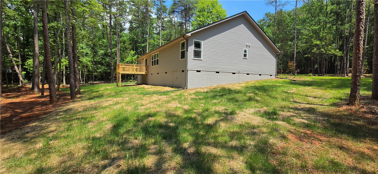 1747 A State Rd S-4-97 Anderson, SC 29621 - Photo 43 of 47 A tranquil wooded setting surrounds this charming home with a delightful rear deck.