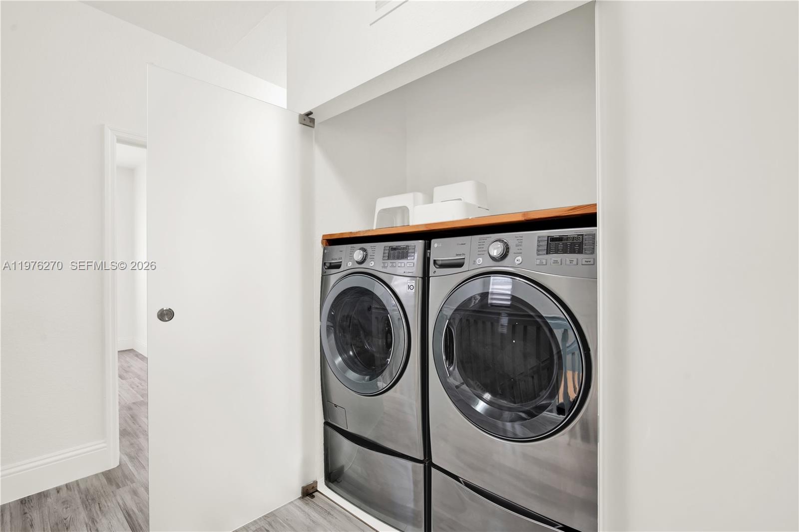 9243 Southwest 227th Terrace Cutler Bay, FL 33190 - Photo 13 of 32 a utility room with dryer and washer