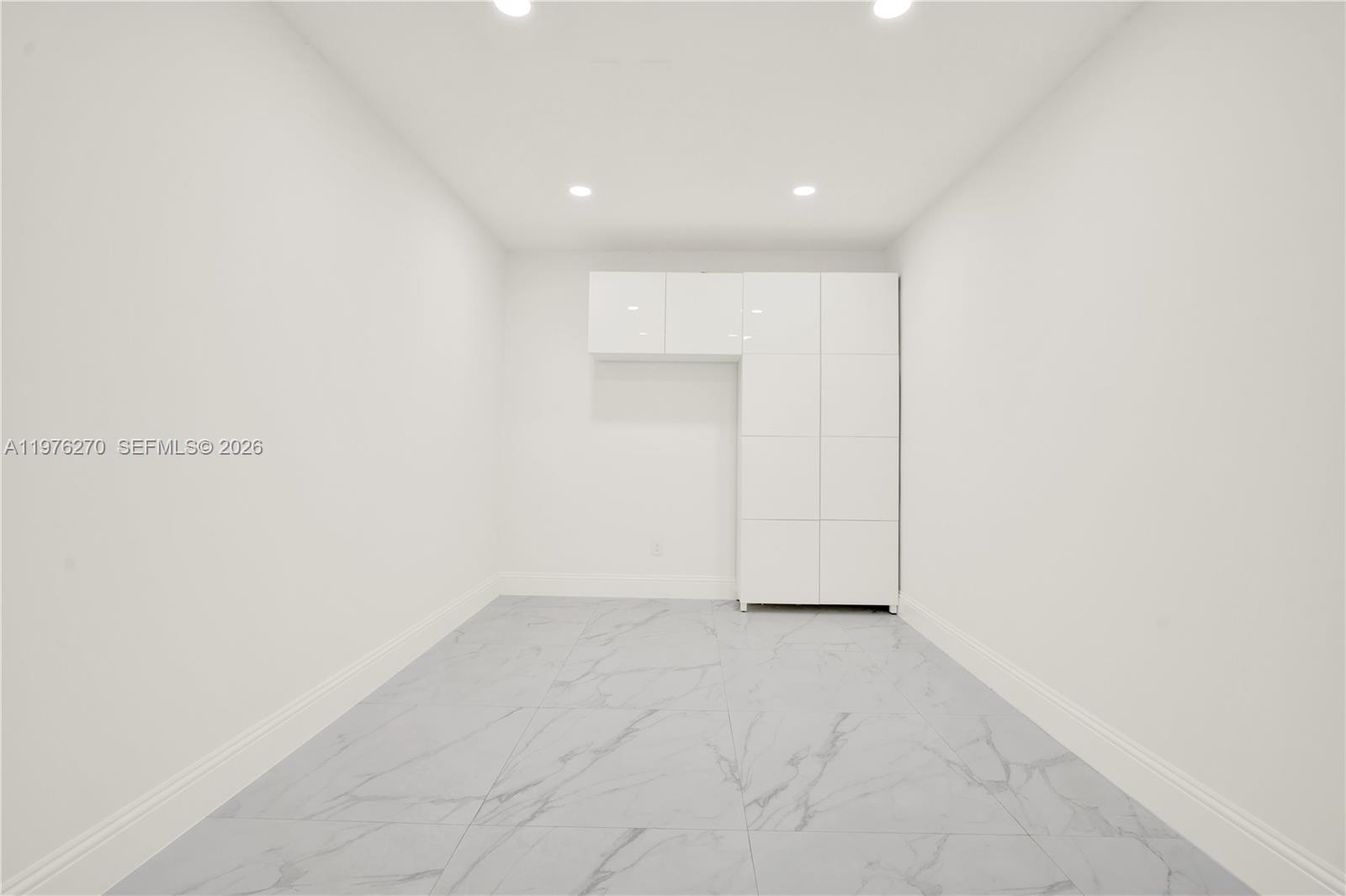 9243 Southwest 227th Terrace Cutler Bay, FL 33190 - Photo 19 of 32 a view of an empty room