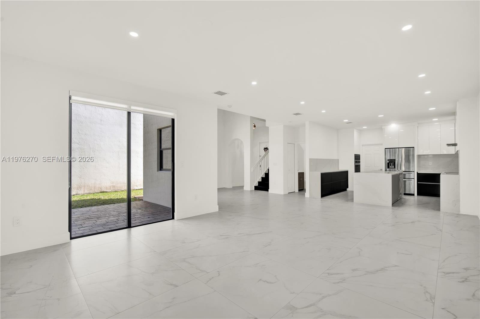9243 Southwest 227th Terrace Cutler Bay, FL 33190 - Photo 25 of 32 a view of a kitchen with a sink and a stove top oven