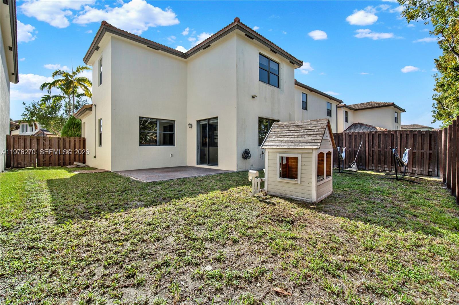 9243 Southwest 227th Terrace Cutler Bay, FL 33190 - Photo 31 of 32 a front view of a house with garden