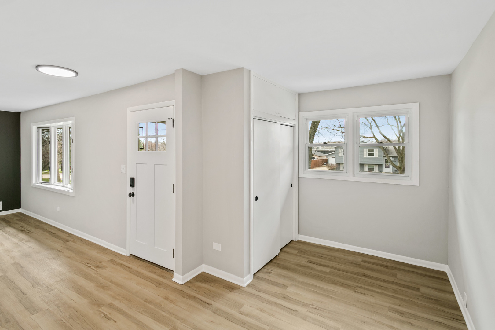 2110 Old Elm Road Lindenhurst, IL 60046 - Photo 7 of 19 a view of an empty room with wooden floor and window
