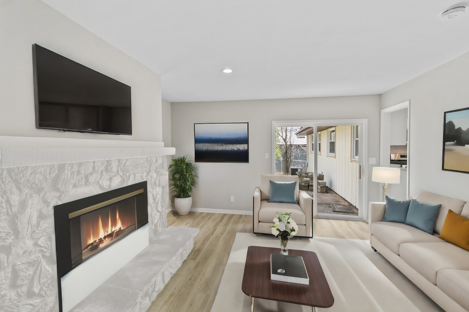 2110 Old Elm Road Lindenhurst, IL 60046 - Photo 10 of 19 a living room with furniture a flat screen tv and a fireplace