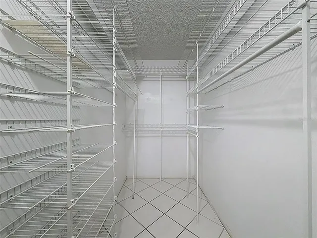 a view of a street with lots of cars parked on the road