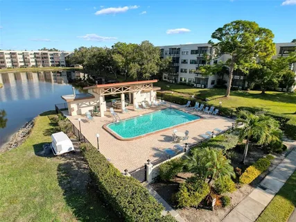 a view of a swimming pool with a patio