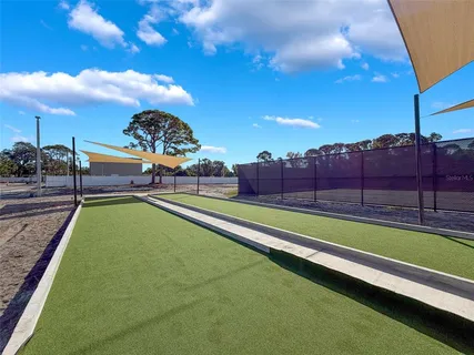 a view of a backyard with swimming pool