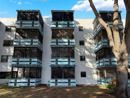 a view of a backyard with swimming pool