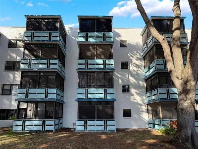 a view of a backyard with swimming pool