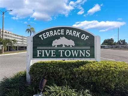 a view of a garden with sitting area