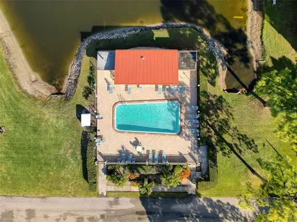 a living room with lots of furniture and a book shelf