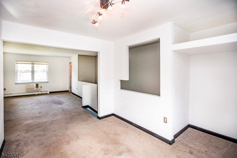 1130 Valley Road, Unit 2B Wayne, NJ 07470 - Photo 14 of 47 an empty room with windows